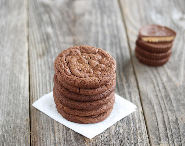 Peanut Butter Cup Cookies stacked up on a napkin