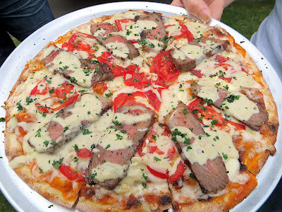 Pulehu Pizza grilled pizza Steak Pizza with grilled steak, tomato, garlic, shaft blue cheese and madeira wine sauce 