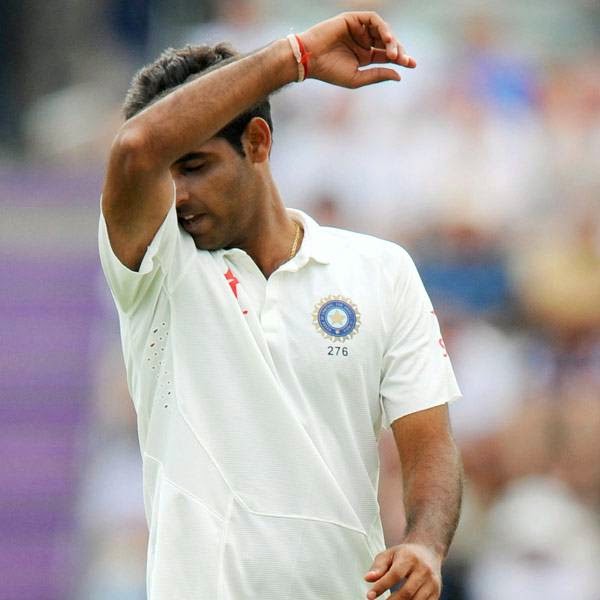 India's Bhuvneshwar Kumar gestures after England captain Alistair Cook hit a four off his bowling during the first day of the third cricket Test match between England and India at The Ageas Bowl cricket ground in Southampton on July 27, 2014.