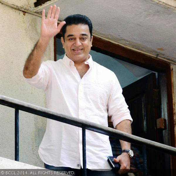 Kamal Haasan waves on his arrival for a press meet on being conferred the Padma Bhushan Award, held at his Alwarpet office.