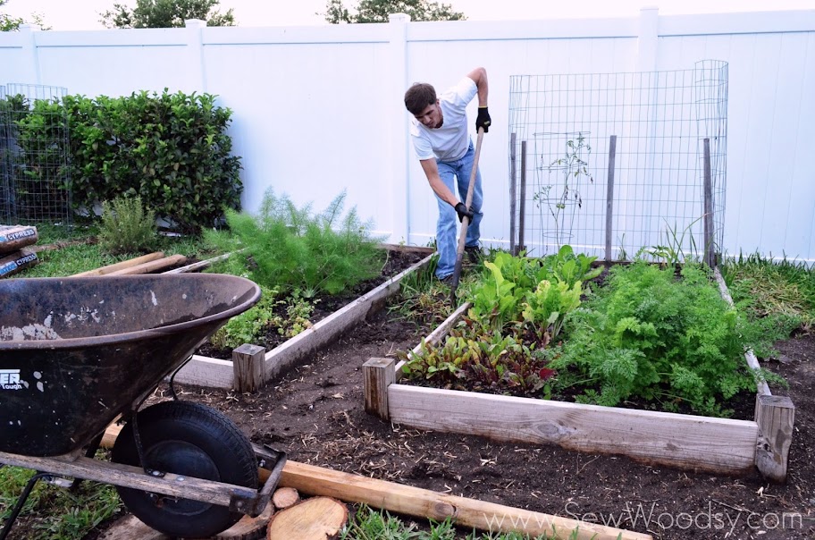 Man removing grass from area. 