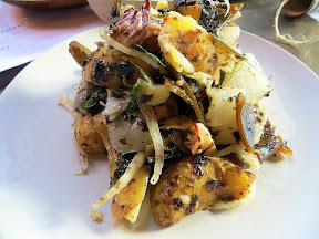 grilled squid salad with Mendocino seaweed and potatoes from the bent brick, portland, neighborhood tavern, drinking food