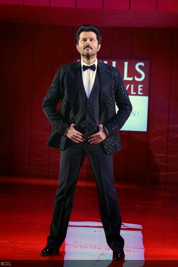 Anil Kapoor showcases a creation by fashion designer Ashish N Soni during the grand finale of the Wills Lifestyle India Fashion Week (WIFW) Spring/Summer 2014, held in Delhi.(Pic: Viral Bhayani)