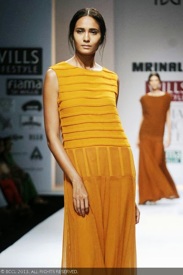 A model flaunts a creation by fashion designer Mrinalini on Day 3 of Wills Lifestyle India Fashion Week (WIFW) Spring/Summer 2014, held in Delhi.