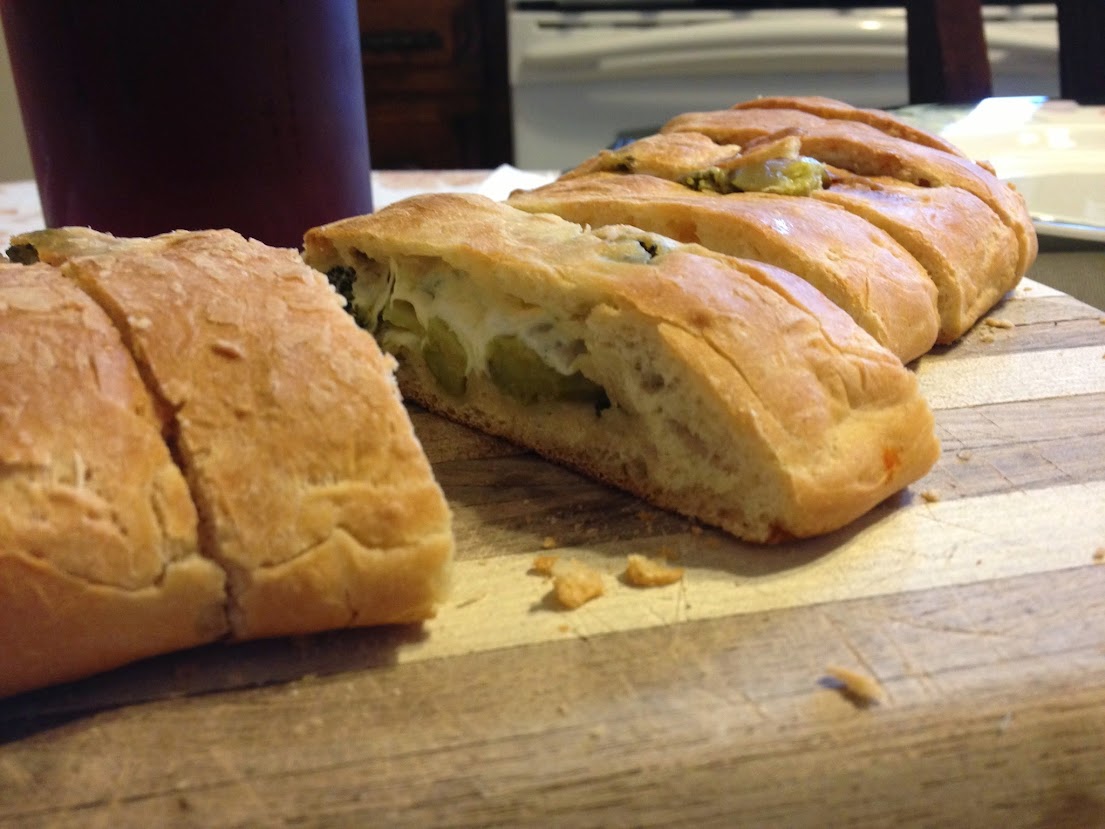 Calzone stuffed with cheese and broccoli 