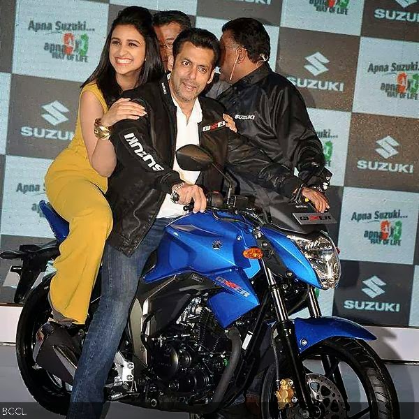 Parineeti Chopra looks all excited to share a ride with Salman Khan at the launch of Suzuki's Gixxer and Let's motorcycles, held in Mumbai, on January 27, 2014.  (Pic: Viral Bhayani)