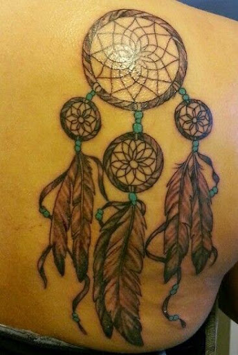 Dreamcatcher Tattoos on the side of the upper back