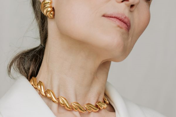 woman wearing gold jewelry