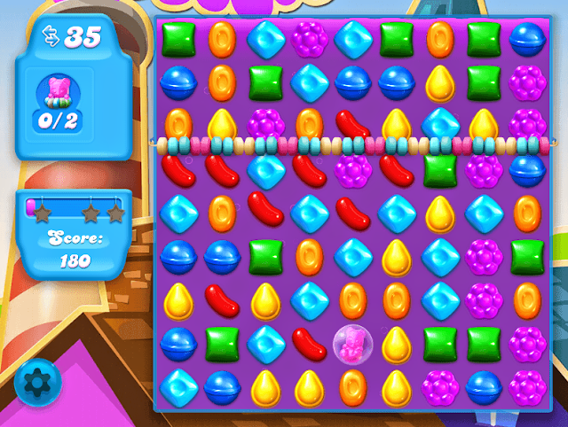 Candy Crush Soda Saga App, level 2 met roze teddybeer en rij snoepjes