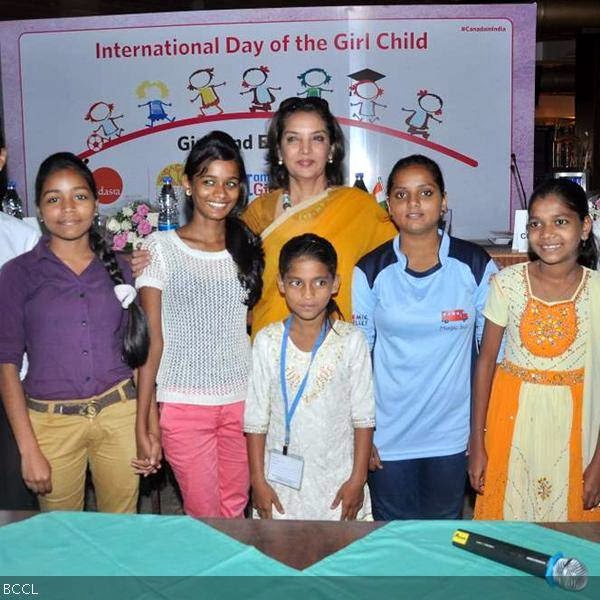Shabana Azmi gets clicked with young girls at International Day Of Girl Child event, held in Mumbai, on October 10, 2013. (Pic: Viral Bhayani)