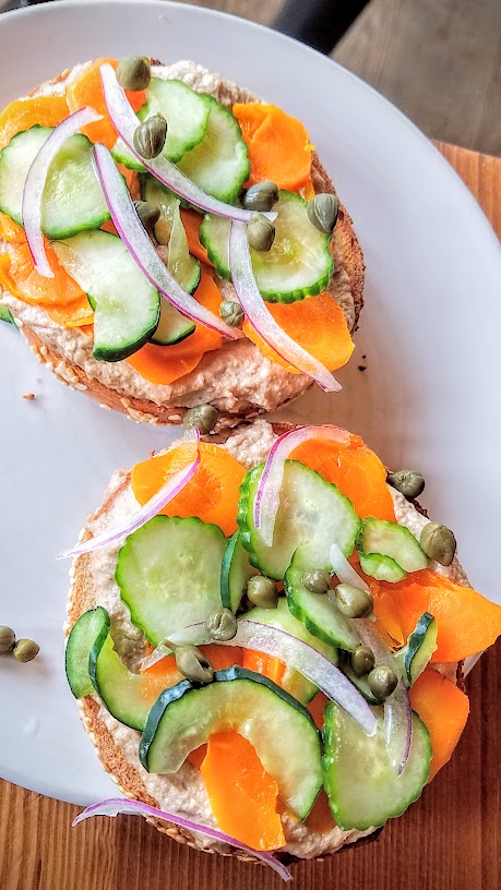 Vegan Lox bagel composed bagel sandwich from Bagel Farm pop up in Portland that comes with choice of bagel, walnut spread, carrot lox, capers, red onions, salted cucumbers. This was my favorite especially on the sesame bagel