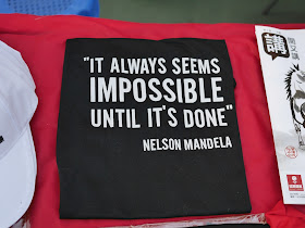 shirt with Nelson Mandela's quote "It always seems impossible until it's done"