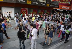 crowds at Dongmen shopping area in Shenzhen, China
