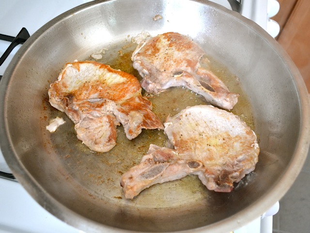 seared pork chops in pan 