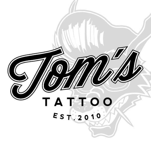 TOM`S TATTOO & PIERCING | München logo