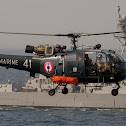 GULF OF OMAN (Jan 2, 2014) An Alouette III helicopter assigned to the 35th squadron of the French aircraft carrier Charles de Gaulle (R 91) hovers near the guided-missile destroyer USS Bulkeley (DDG 84). Bulkeley, part of the Harry S. Truman Carrier Strike Group, is conducting operations with ships assigned to French Task Force 473 to enhance levels of cooperation and interoperability, enhance mutual maritime capabilities and promote long-term regional stability in the U.S. 5th Fleet area of responsibility. (French navy photo by Chief Petty Officer Frederic Duplouich/Released)