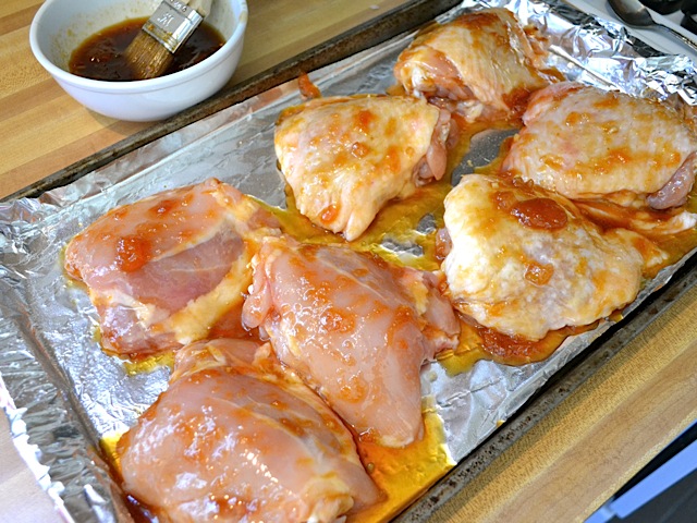 chicken coated in sauce ready to cook