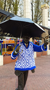 #UglySweaterPDX campaign, 2014: Some of downtown’s most iconic sculptures will don their holiday finery for the season. In the Pioneer District on Southwest Yamhill and Morrison streets (between Fifth and Sixth avenues), you’ll see Animals in Pools, Allow Me (aka “Umbrella man”) and Kvinneakt dressed up in festive ugly sweaters.