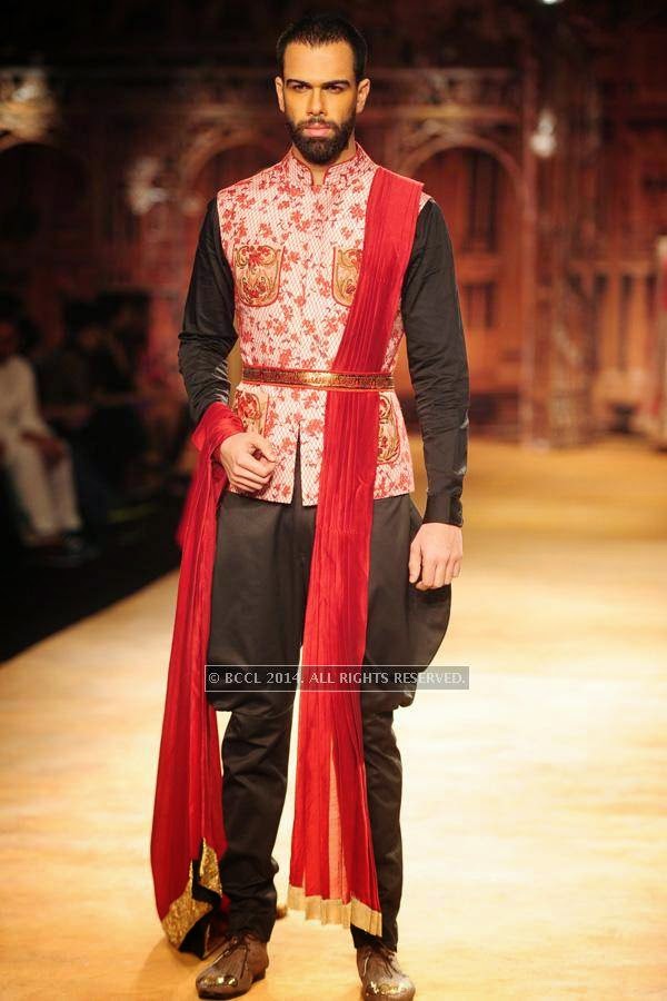 A model walks the ramp for Sulakshana on Day 6 of India Couture Week, 2014, held at Taj Palace hotel, New Delhi.