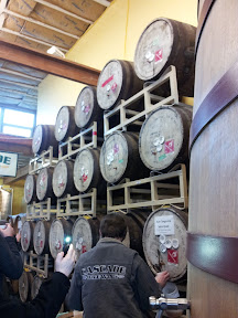 Admiring the wall of barrels at Cascade Brewing