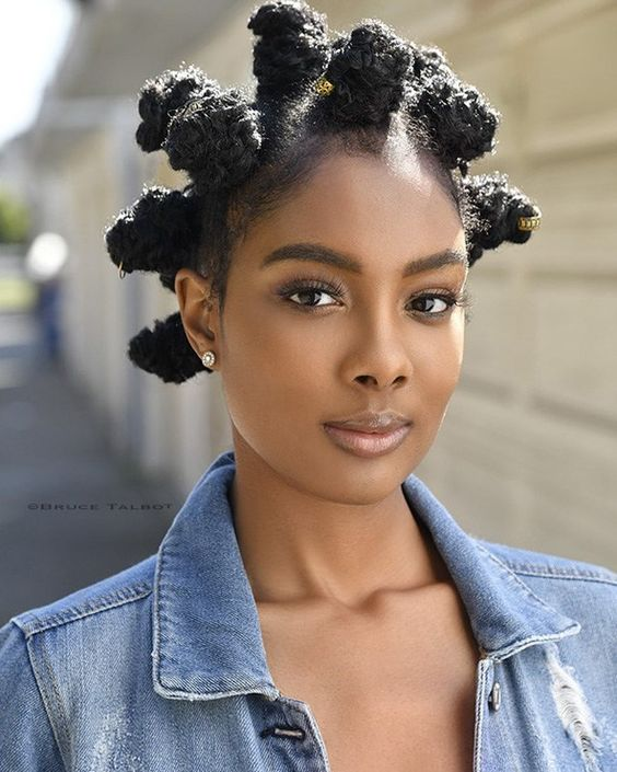 a lady wearing bantu knots for styling natural short hair