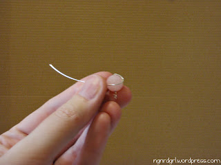 Start wrapping the wire around the bead