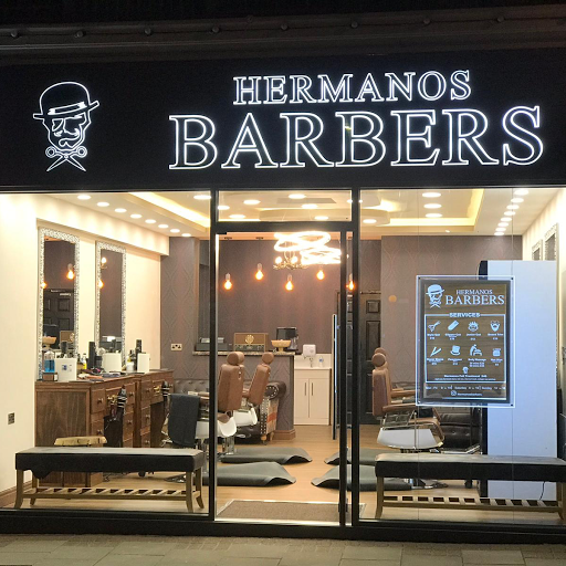 Hermanos Barbers logo