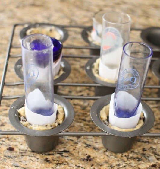 photo showing how to use cylinders to keep the cookie shot shape while they bake
