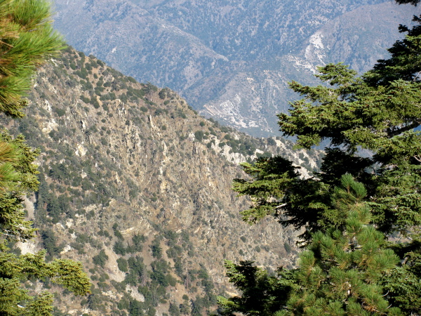 large mountainside where the twisted layers of rock are visible