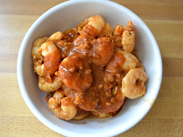 sauce poured back over shrimp in bowl 
