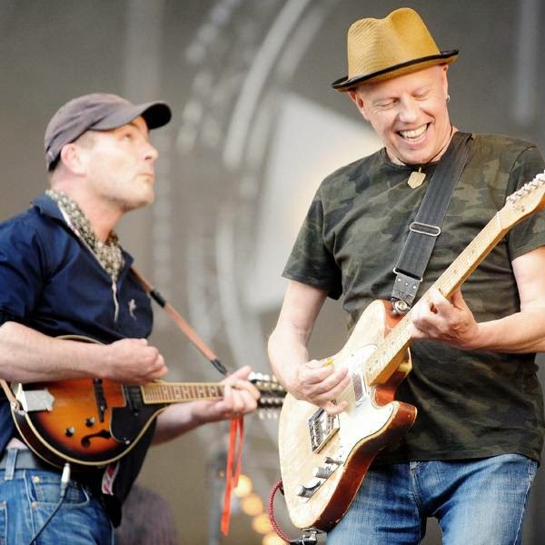 Scottish singer and guitarist of The Celtic Social Club Jimmy O'Neill (R) and French musician Jean-Pierre Riou (L) perform during the 23rd edition of the Festival des Vieilles Charrues in Carhaix-Plouguer, western France, on July 18, 2014.