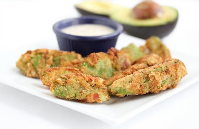 photo of avocado bacon fries on a plate with dipping sauce