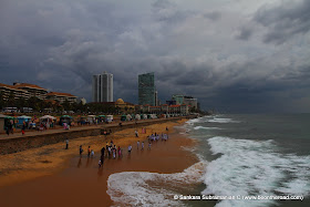 Locals and Tourists throng to Colombo's Marine Drive on a cloudy afternoon