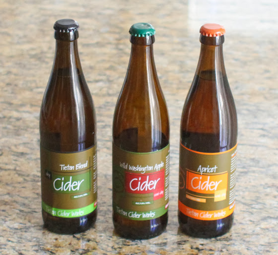 photo of three bottles of apple cider