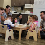 LePort School Parent & Child Montessori parents gather at the "weaning table" offering their babies snack at school.