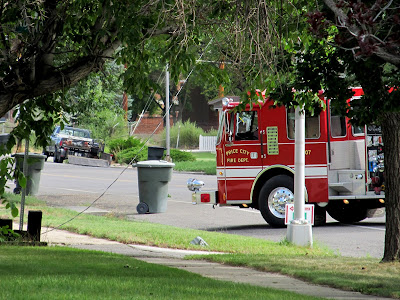 Fire truck blocking the road near the fallen power line