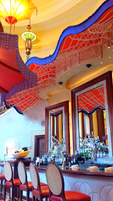 Relaxing in the Parasol Down bar and lounge (Parasol Up is on the same level before you go down the curved escalator) inside The Wynn. This is where after dusk you can also sit and see the various Lake of Dreams shows every 30 min)
