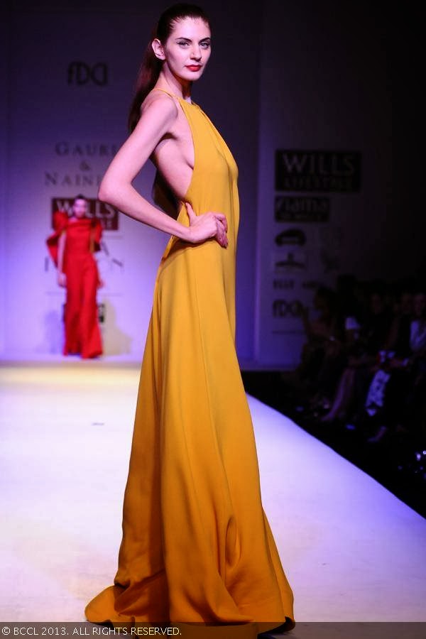 Olga walks the ramp for fashion designers Gauri and Nainika on Day 1 of the Wills Lifestyle India Fashion Week (WIFW) Spring/Summer 2014, held in Delhi.
