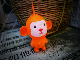 hanging orange toy monkey in Cheung Chau