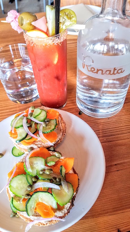 Vegan Lox bagel composed bagel sandwich from Bagel Farm pop up in Portland that comes with choice of bagel, walnut spread, carrot lox, capers, red onions, salted cucumbers. This was my favorite especially on the sesame bagel