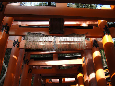 Torii with wheat suspended across them