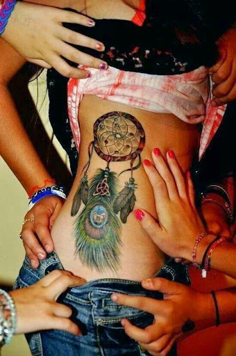 Dreamcatcher Tattoos for girls on the side of the chest