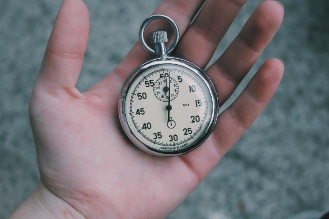A hand holding a pocket watch

Description automatically generated with medium confidence