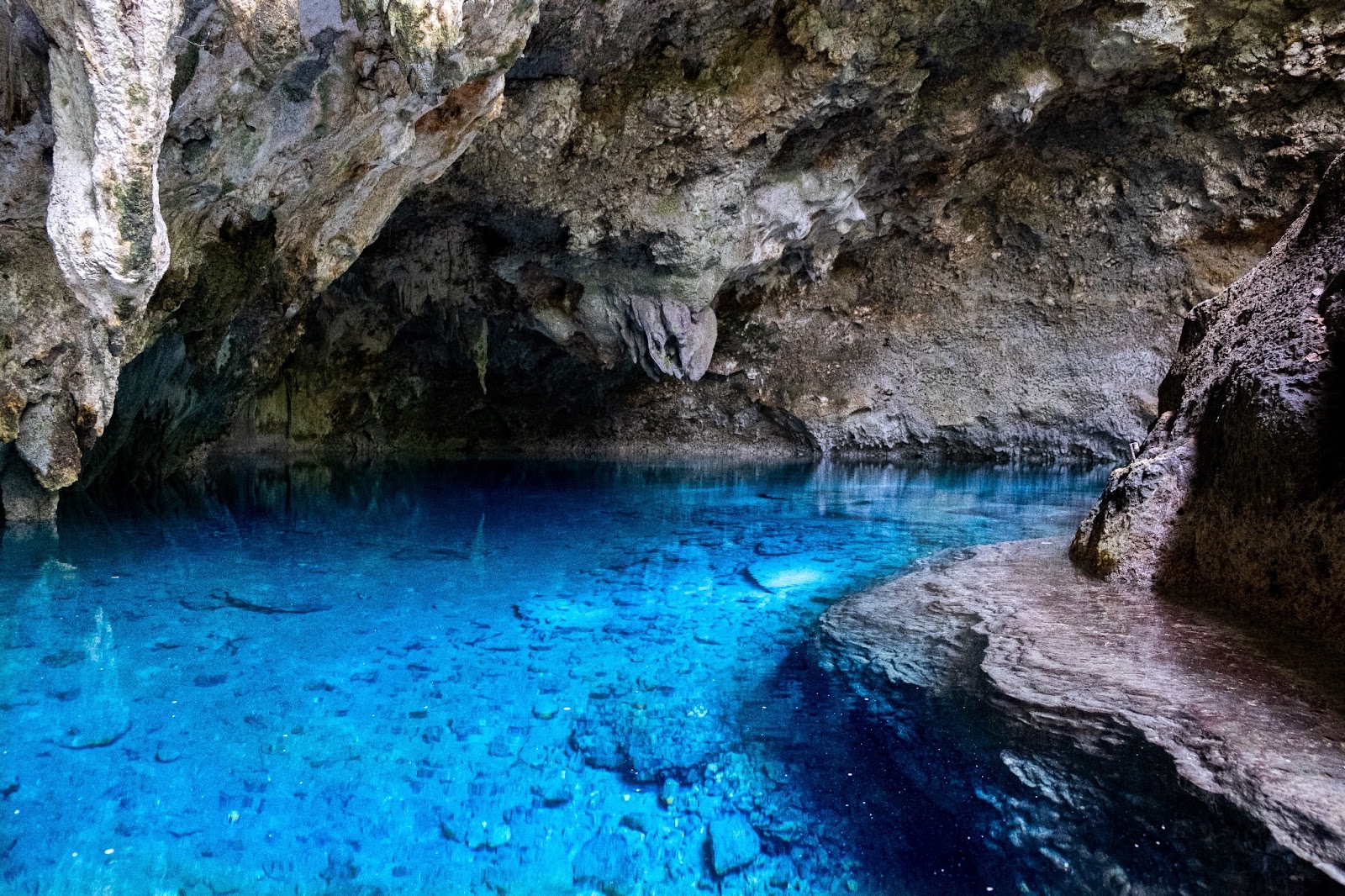 A mysterious cave within the Samana Peninsula featuring the turquoise ocean.