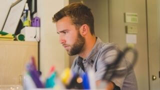 a-man-working-very-hard-on-his-computer