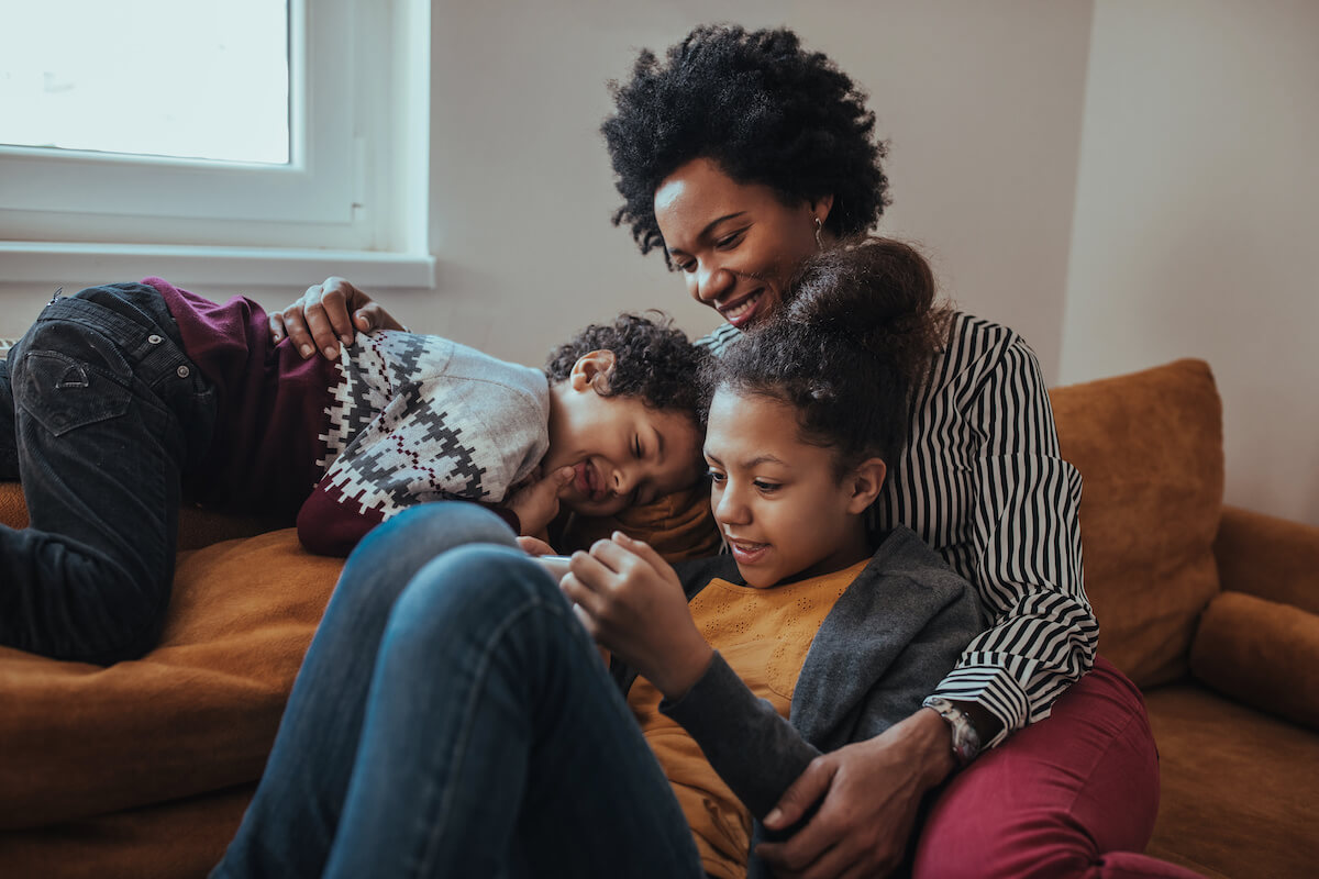 Family looking at a phone