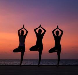 A group of people jumping on a beach

Description automatically generated with low confidence