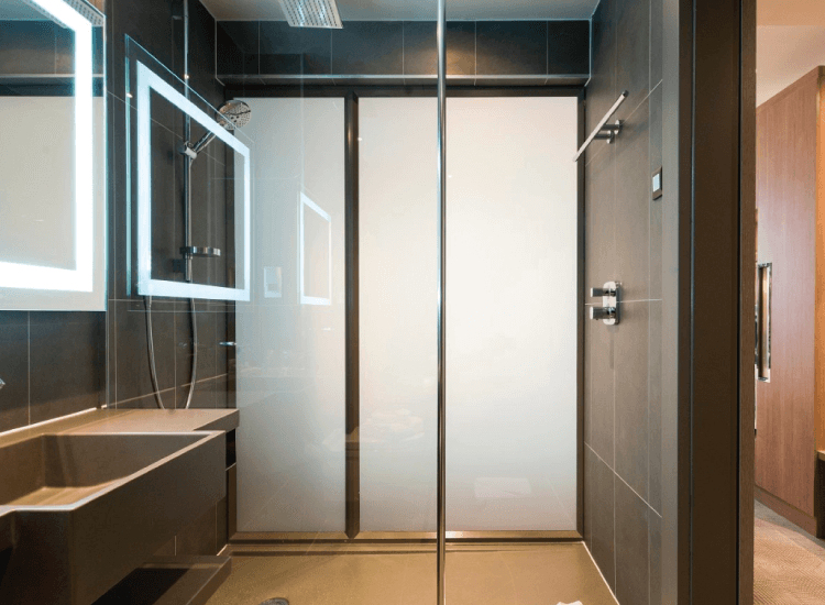 A bathroom partition integrated with smart glass. Source: intelligent glass