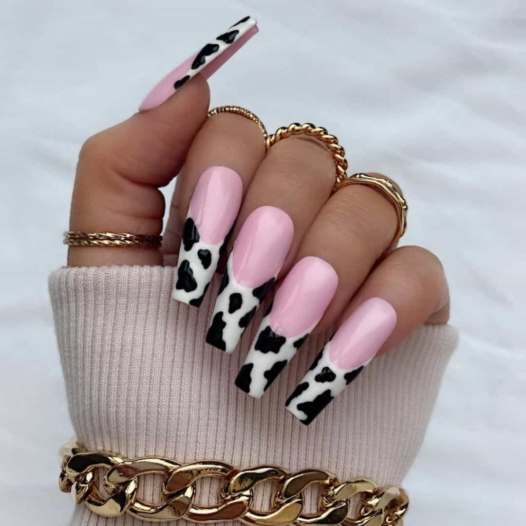 Full picture of a lady rocking  statement accessories with her gorgeous nails