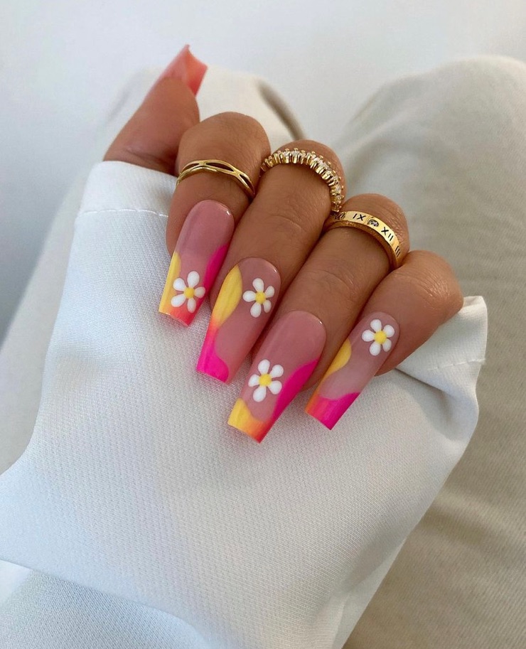 Bright pink and yellow summer nails with a white flower and unique french manicure